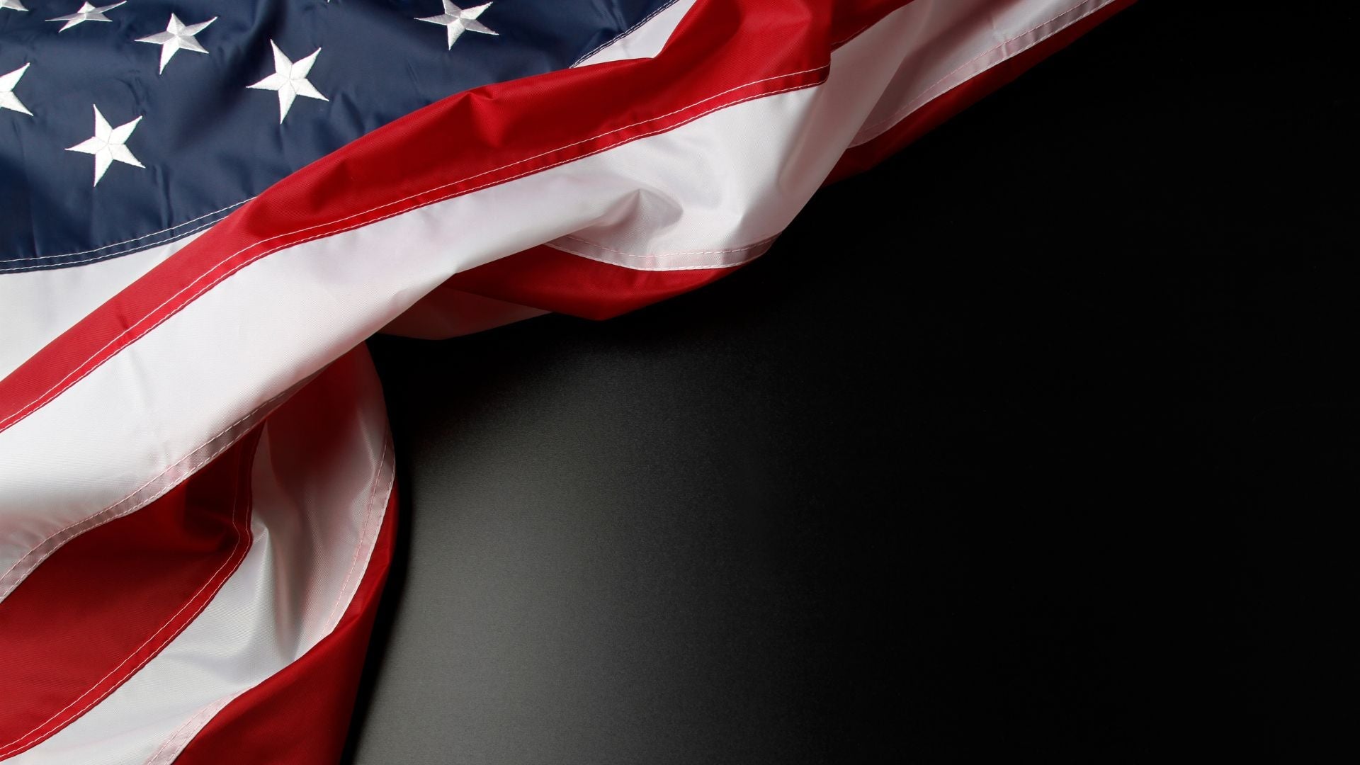 Dark textured background with an American flag design